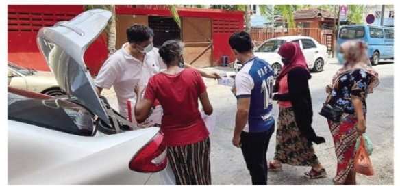 fr joachim delivering food to the migrants under sharing hope the power of resilience write up