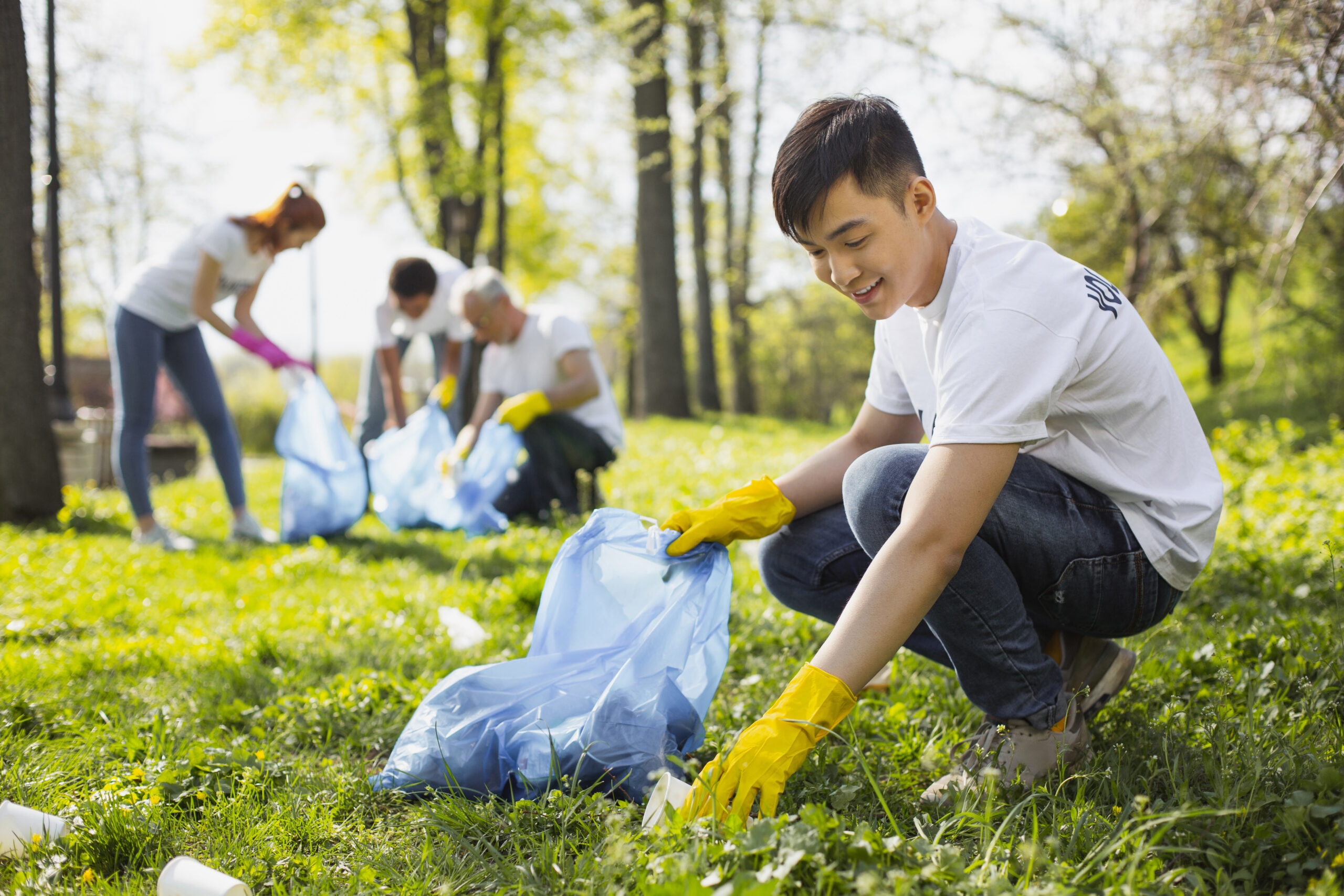 handsome male volunteer taking trash