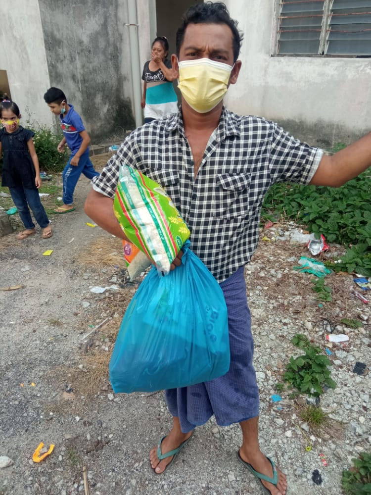 refugee man receiving aid